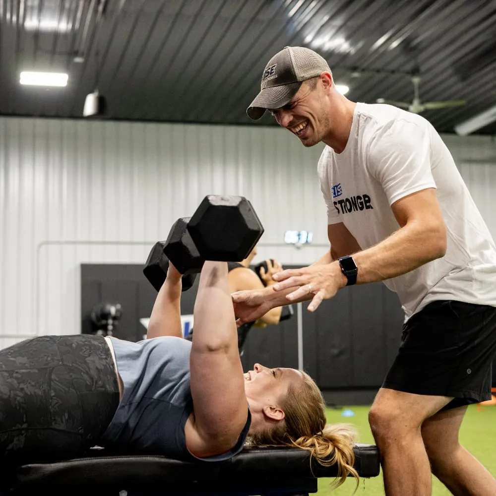 Member performing bench press